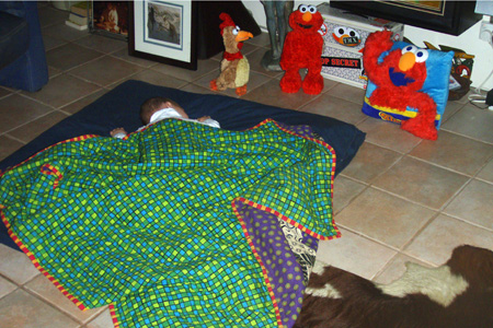 Nap time on Grandpa's patchwork quilt